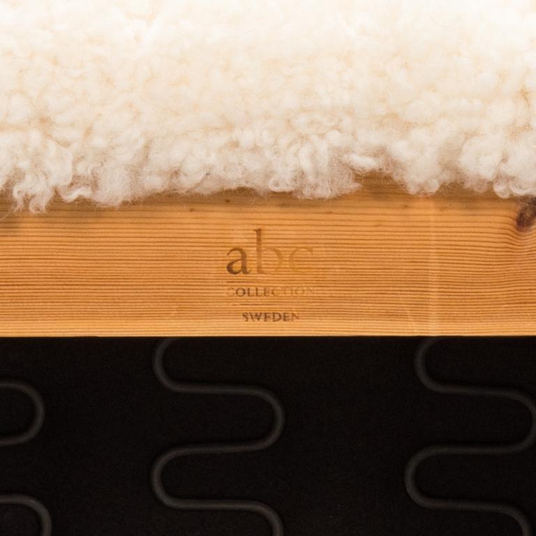 A contemporary sheepskin upholstered lounge chair, ABC collection.