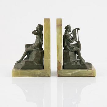 A pair of onyx and patinated bronze bookends, 1920's.