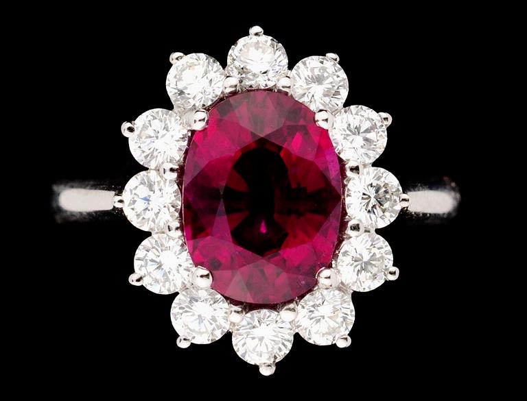 A gold, rubellite and diamond ring.
