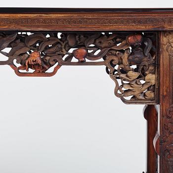 A massive zitan recessed-leg long table 'Jiaotousun Qiotouan', Qing dynasty, 19th century.