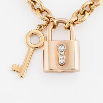 Collier, 18K guld, Gübelin, med 
berlock/hänge i form av lås Gübelin med briljantslipade diamanter.