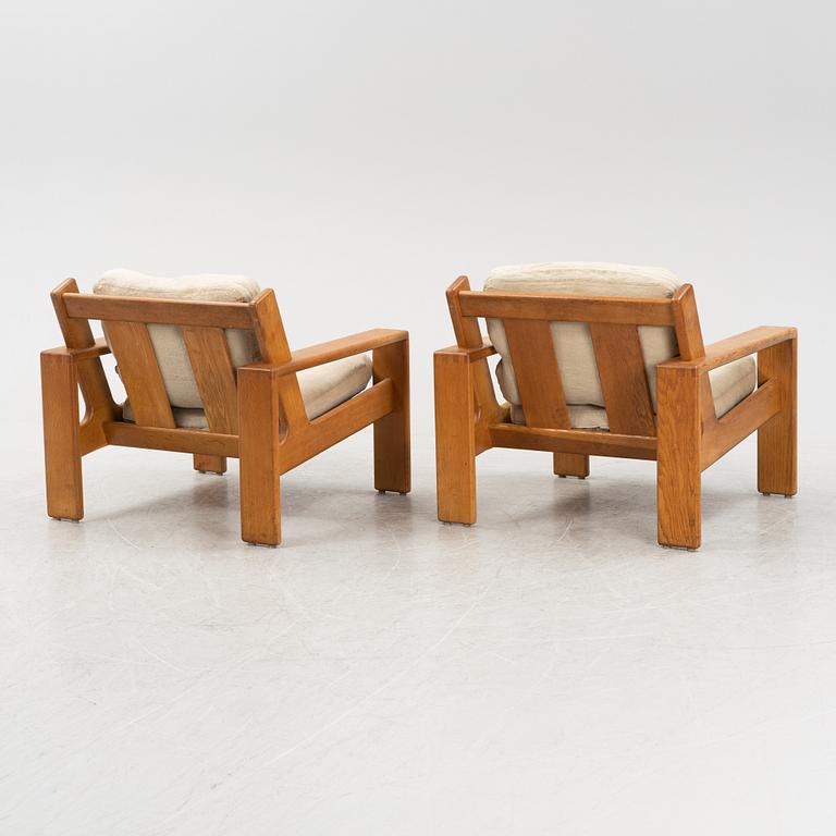 Esko Pajamies, a pair of oak 'Bonanza' lounge chairs from Asko, 1970's.