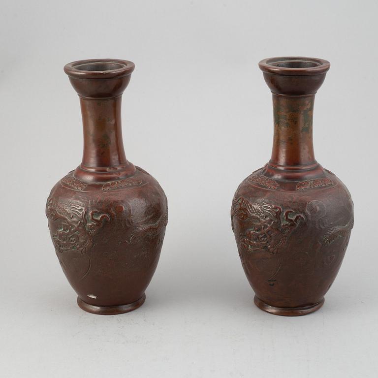 A pair of Japanese copper alloy temple vases, Meiji period (1868-1912).