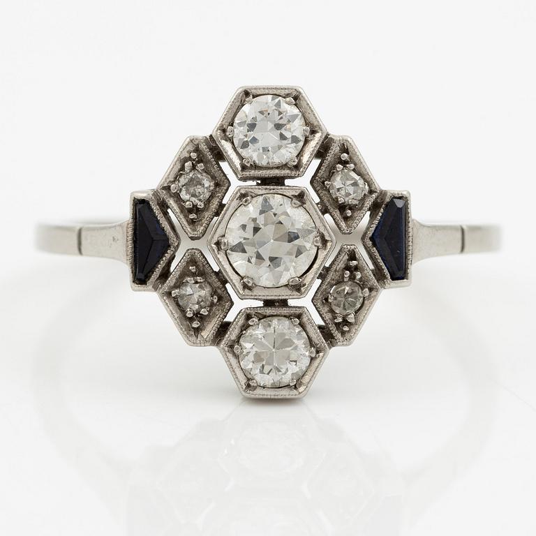 A platinum ring set with round brilliant-cut diamonds and sapphires, Art Déco.