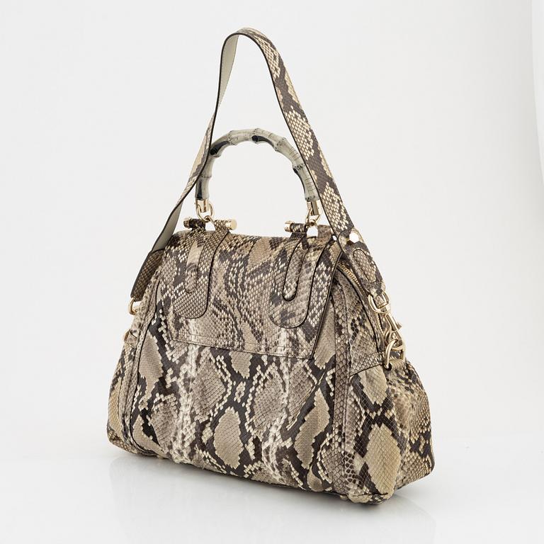 Gucci, a 'Pop Bamboo' python bag.