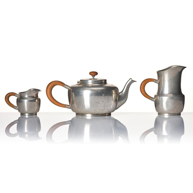 Josef Frank, a four-piece pewter tea set and a plate, model "A2330", Firma Svenskt Tenn, Stockholm 1946 (plate 1929).