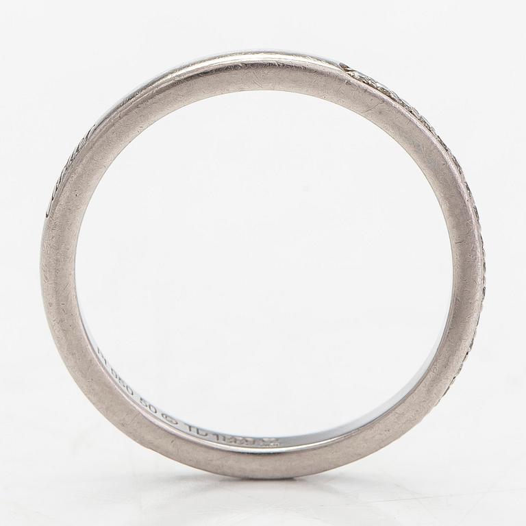 Cartier, a half eternity ring, platinum with brilliant-cut diamonds. With certificate.