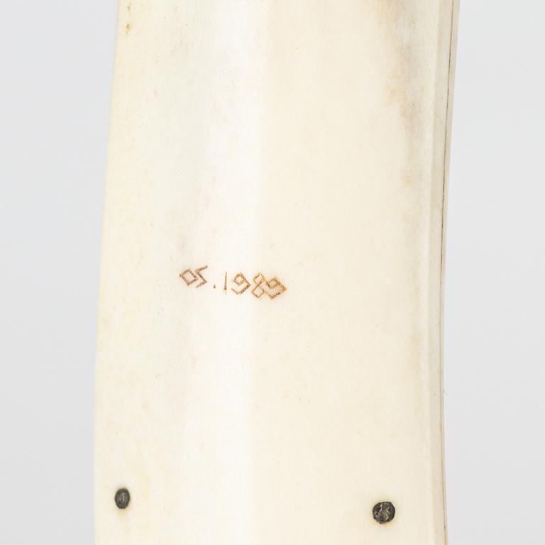 A reindeer horn knife by Olav Svonni, signed and dated 1989.