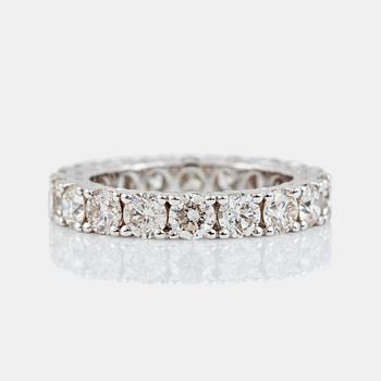 1290. An eternity diamond ring, total carat weight 3.93 cts according to engraving. Quality circa I-K/SI.