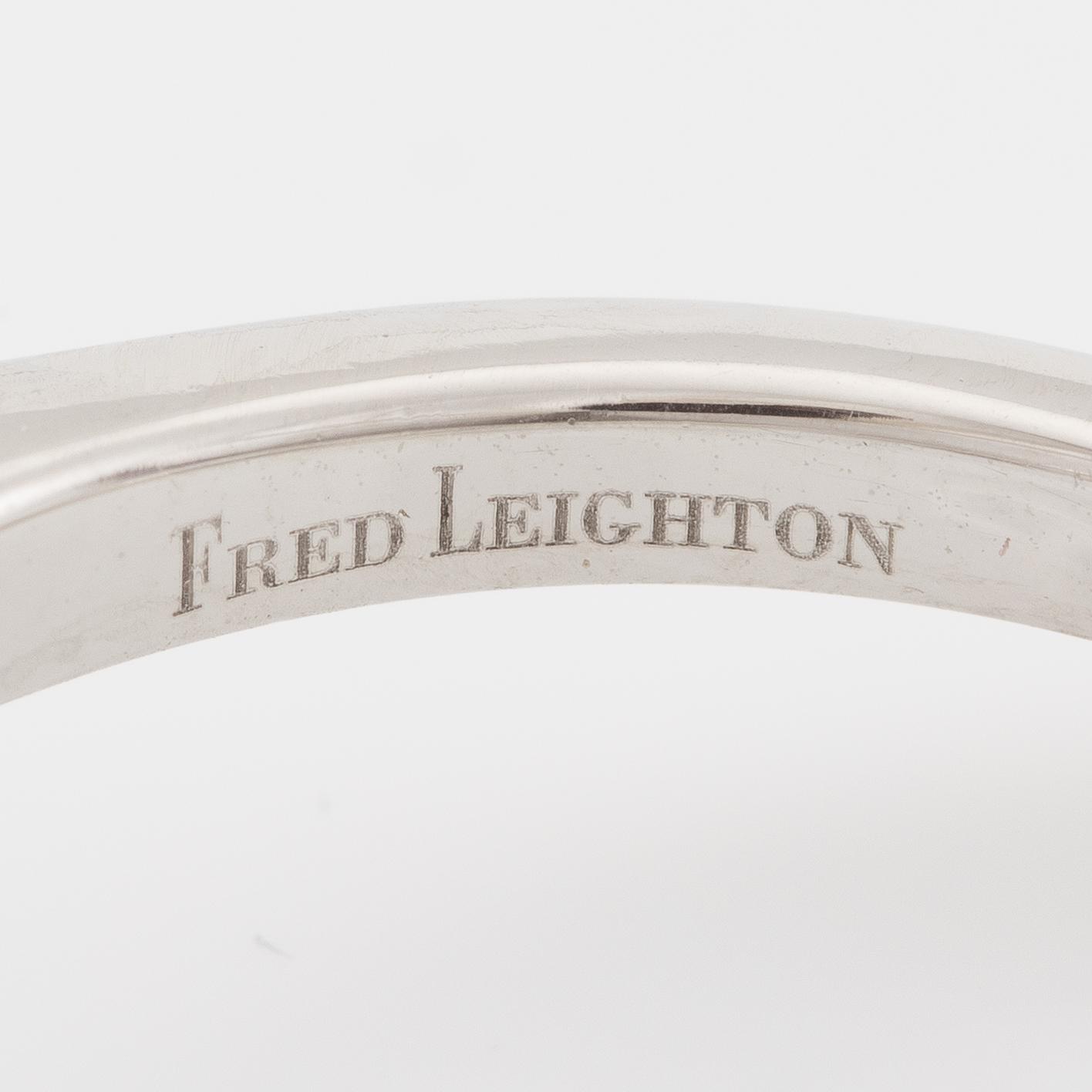 Ring, Fred Leighton platinum with an oval faceted tanzanite and fancy-cut diamonds.