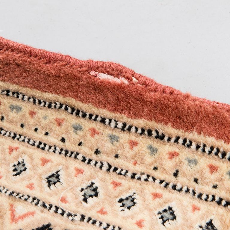 A rug from Karachi. Ca. 176x128 cm.