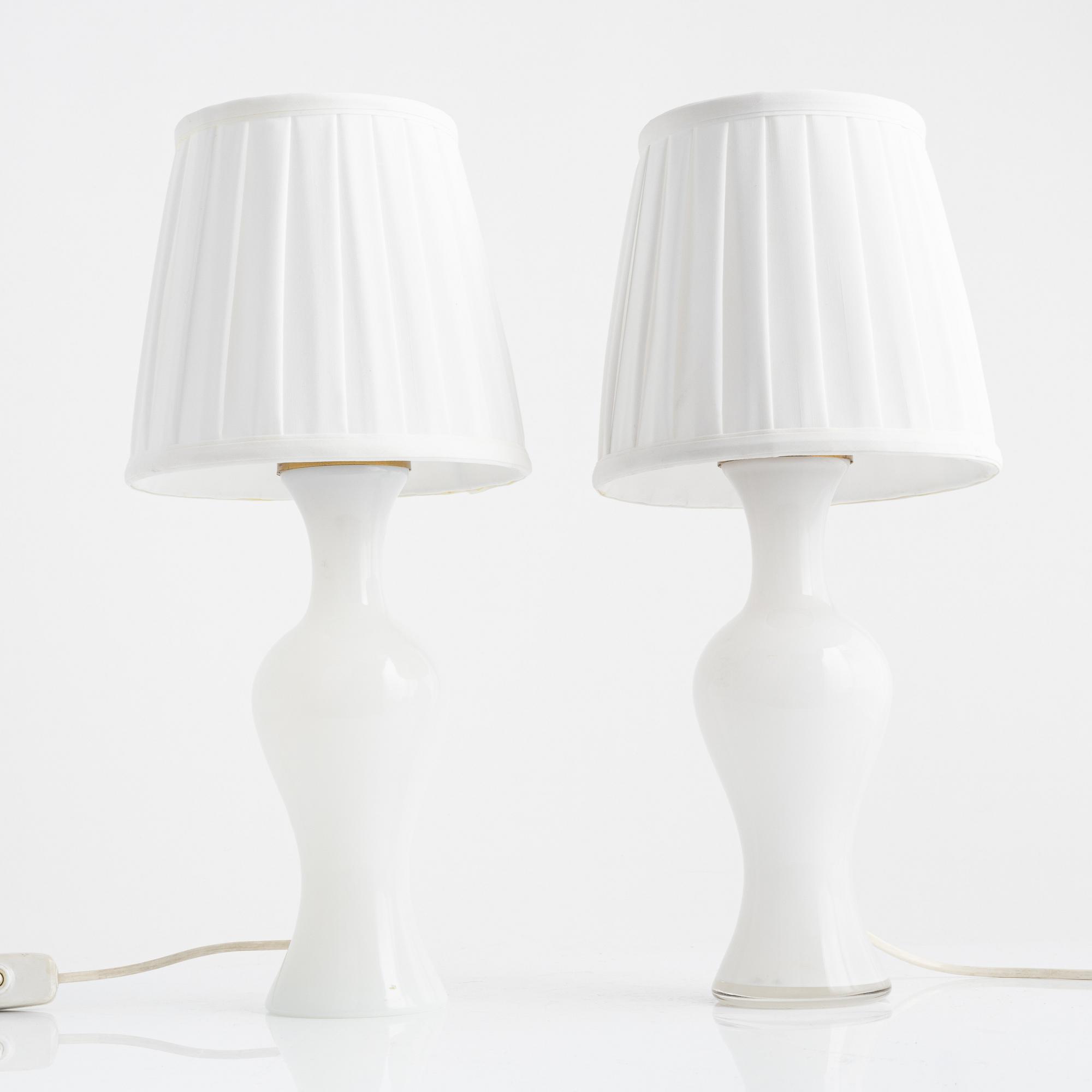 A pair of similar glass table lights from Lindshammars glasbruk, probably designed by Gunnar Ander.