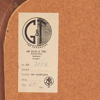 A mid 20th century mirror by G&T.