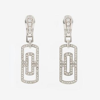 A pair of Bulgari "Parentesi" in 18K white gold with round brilliant-cut diamonds.