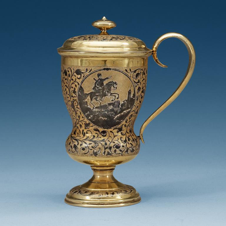 A Russian 19th century silver-gilt and niello cup and cover, unidentified makers mark Moscow 1857.