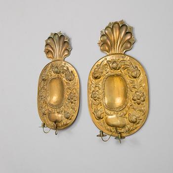 a pair of brass wall plates by Johan F. Hellström, Nyköping, 1901.