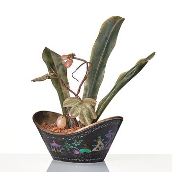 A Chinese miniature 'hard stone' flower arrangement in a ingot shaped lac burgauté pot, Qing dynasty, 18th century.