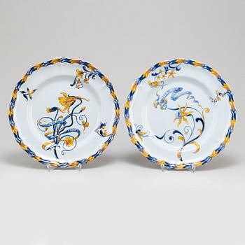 A set of four french faience cabinet plates signed Emile Gallé, Nancy. C. 1900.