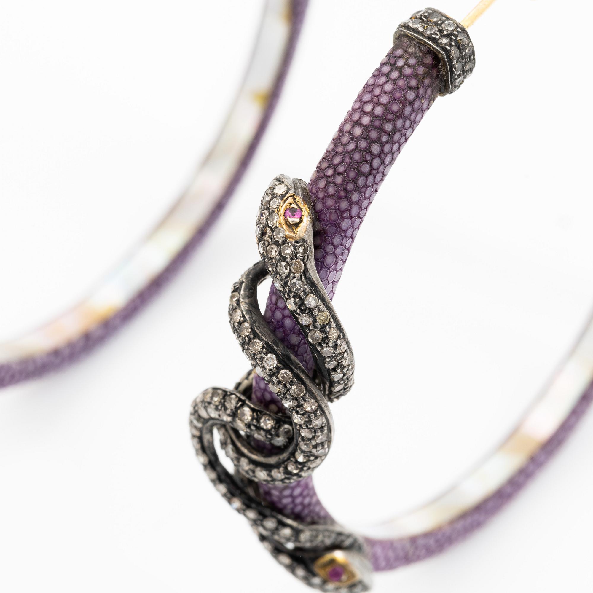 A pair of earrings in the shape of a snake, leather, mother-of-pearl and silver, with  diamonds in various cuts.