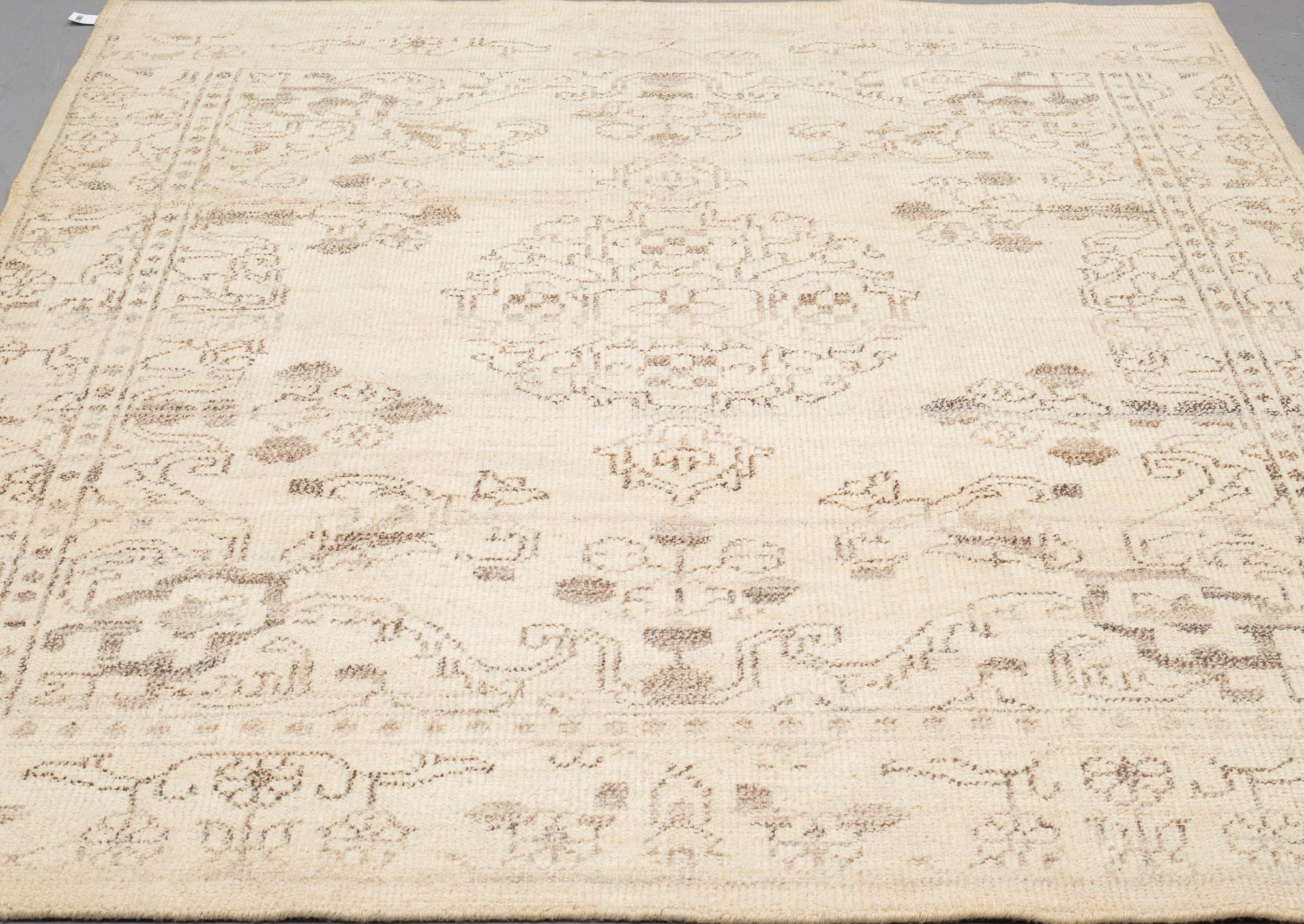 An oriental carpet, ca 250 x 204 cm.