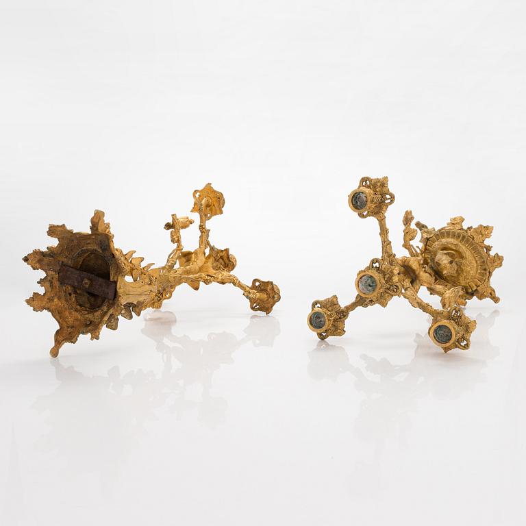 A pair of gilt brass candelabra from the latter half of the 19th century.