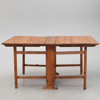 A pine gate-leg table, 19th Century.