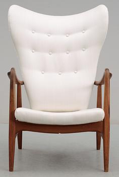 A Danish upholstered wing-back armchair, 1940-50's,