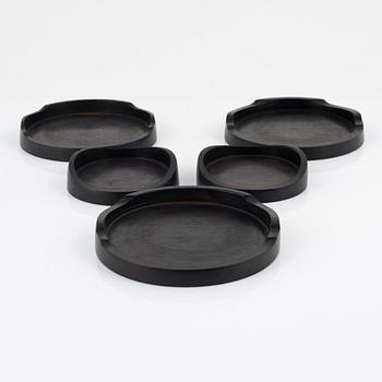 Magnus Ek, a set of five ebony coasters for Oaxen Krog.