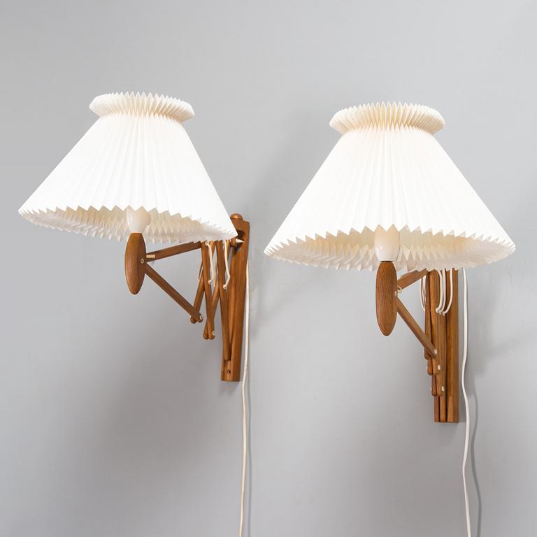 Erik Hansen, a pair of oak wood 'Saxelampe' wall lights, Le Klint, Denmark.