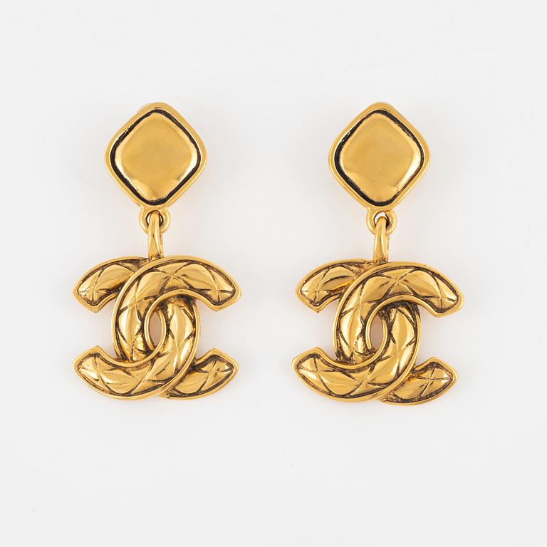 Chanel, a pair of gold tone clip-on earrings, 1990-1992.