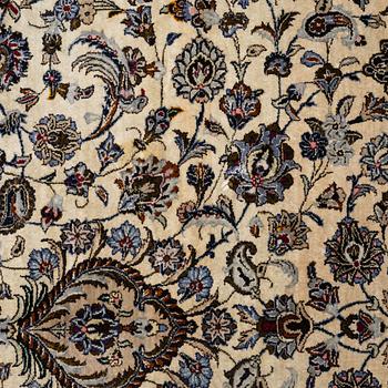 A semi-antique silk Keshan carpet, c. 350 x 248 cm.