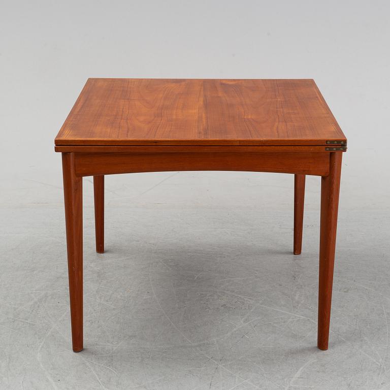 A teak dining group, table and six chairs model no. 49, designed by Erik Buch, Denmark, in 1949.