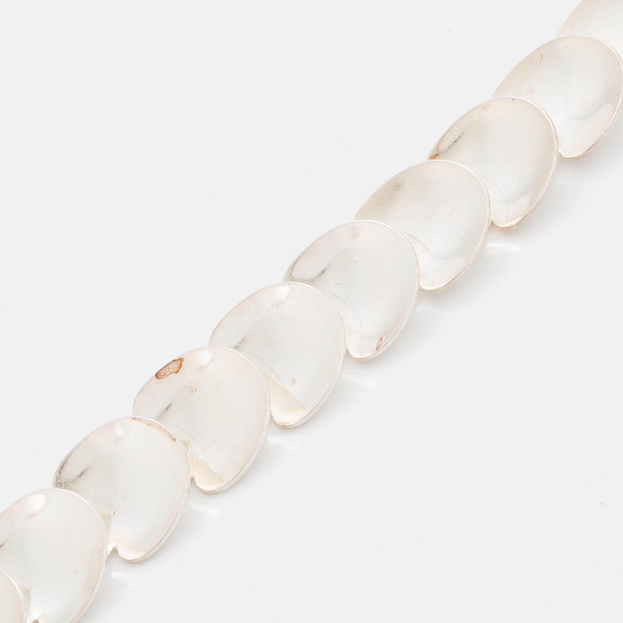 A silver necklace by Viggo Wollny.