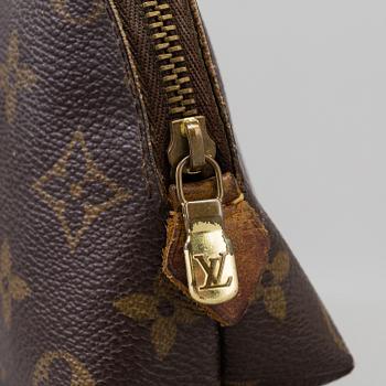 a LOUIS VUITTON make-up bag.