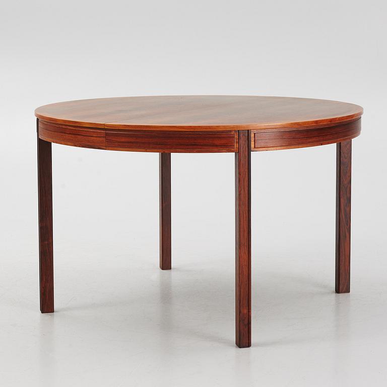 Bertil Fridhagen, a rosewood-veneered dining table with four chairs, BOdsfors, Sweden, 1960's.