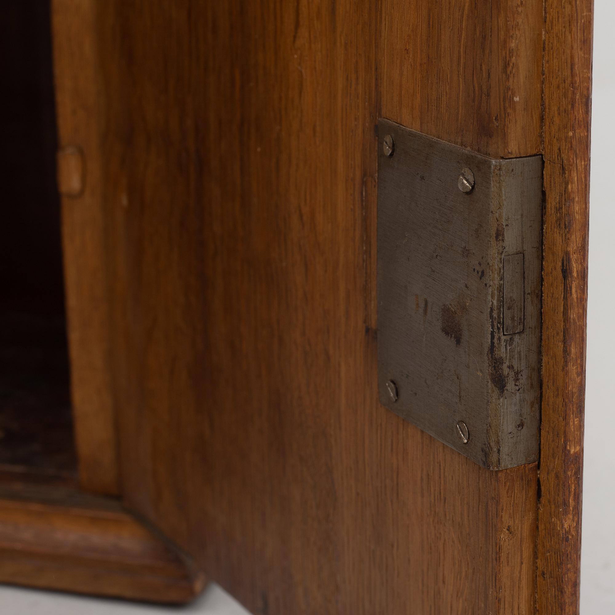 A wall cabinet, dated 1765.