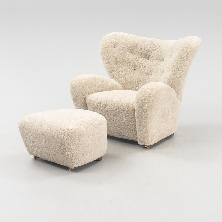 A 'The tired man' lounge chair with stool by Flemming Lassen by Lassen, designed 1935.