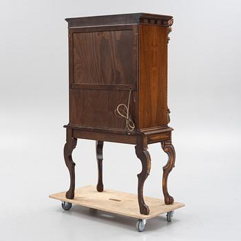 A Baroque style drinks cabinet, first half of the 20th Century.