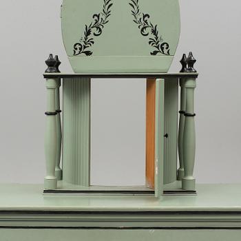 A combined clock and chest of drawers from late 19th  century.