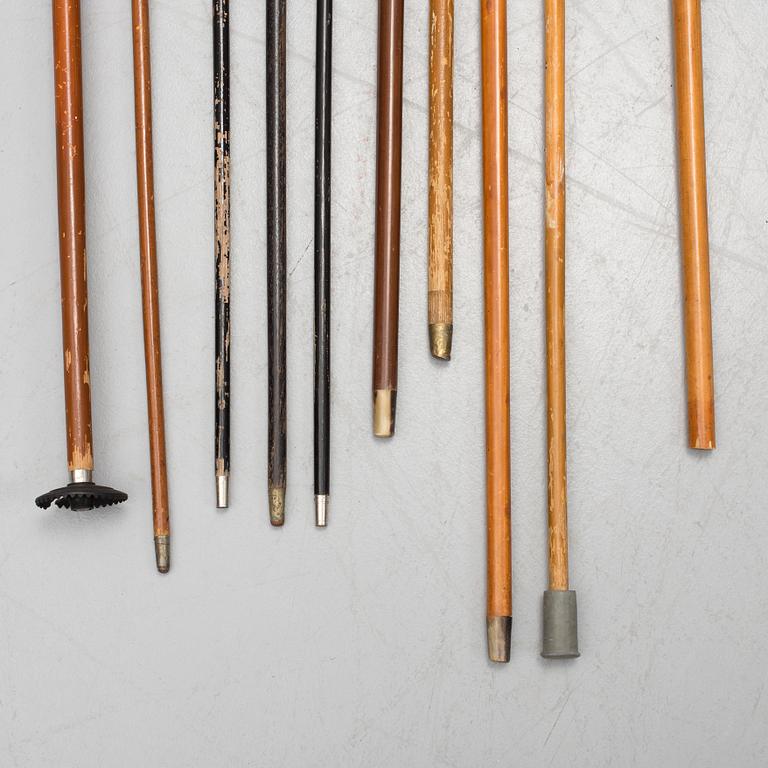 NINE WALKING STICKS, silver handles and a stick with plate handle, first half of the 20th century.