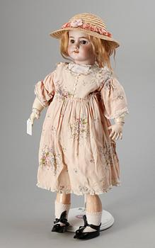 A German/French bisquit doll, around 1900. Marked DEP.