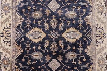 An oriental carpet of Mamluk design, c. 300 x 245 cm.