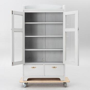 Display cabinet, early 20th century.