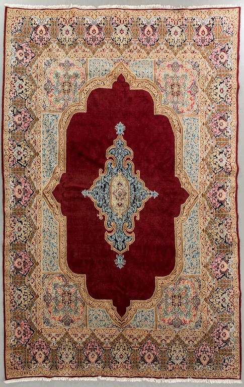 A semaintique Kirman carpet ca 369 x 290 cm.