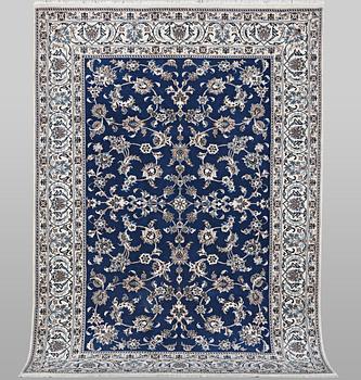 A carpet, Nain, part silk, ca 297 x 194 cm.