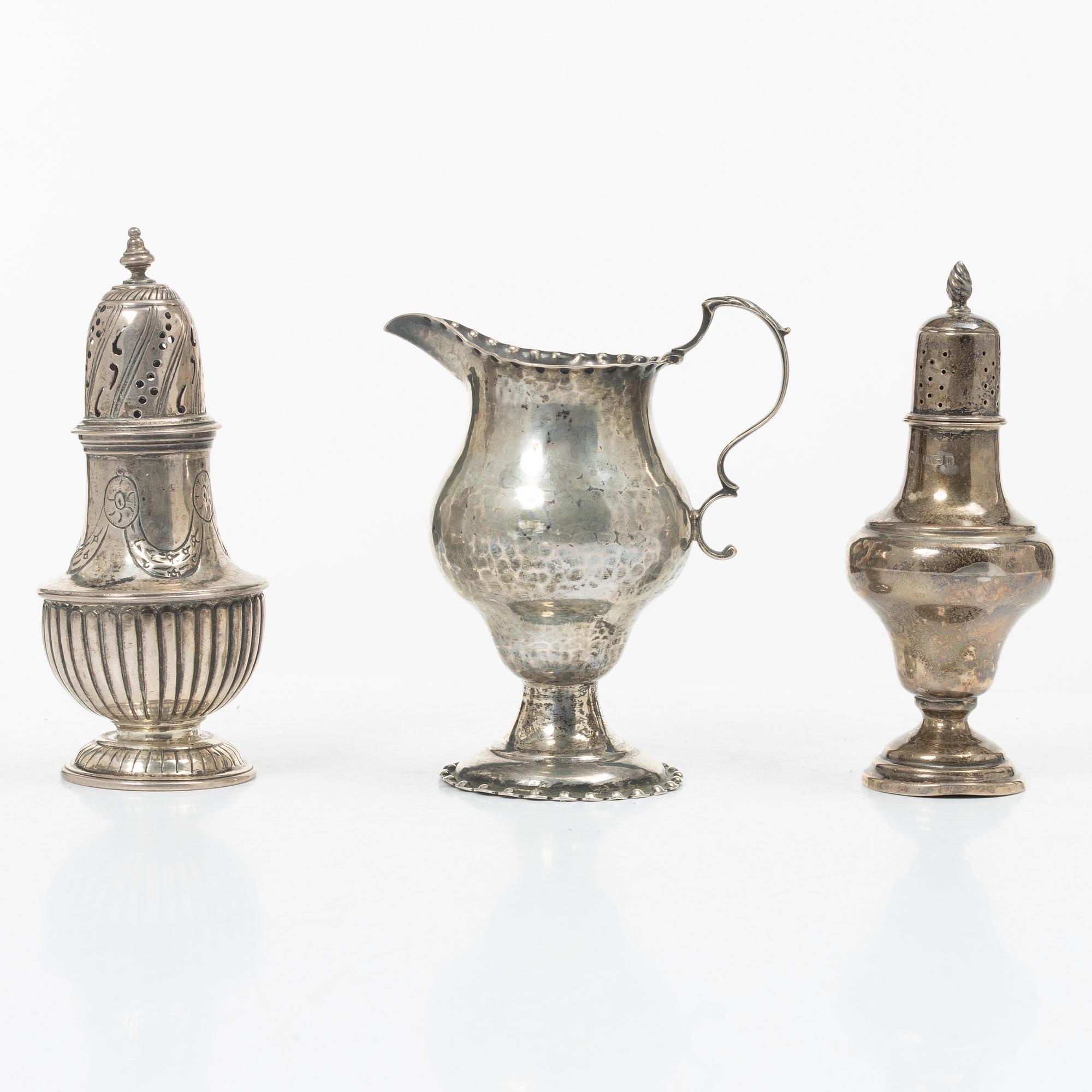 Two silver casters and cream jug, England.