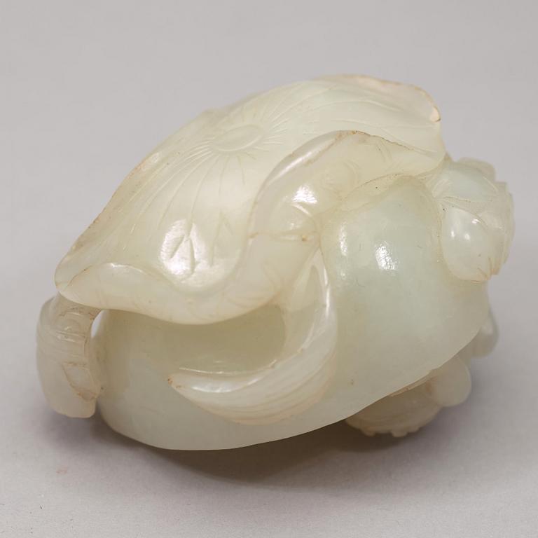 A pale celadon nephrite carving of a lotus pod, Qing dynasty (1644-1912).