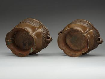 A pair of bronze flower pots, Qing dynasty, with Xuande six character mark to the interior.