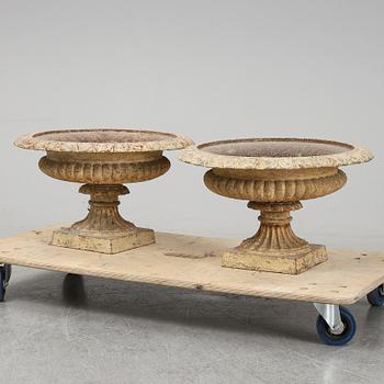 A pair of cast iron plat pots.