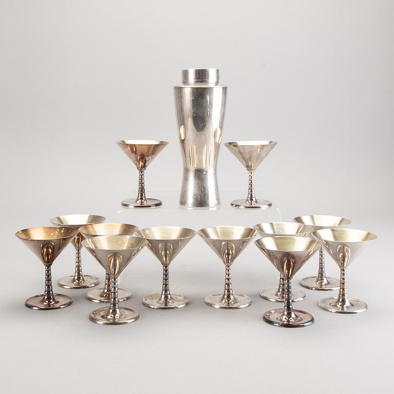 A set of 12 silver plated cocktail glasses and a shaker mark By CG Hallberg Stockholm mid 1900s.